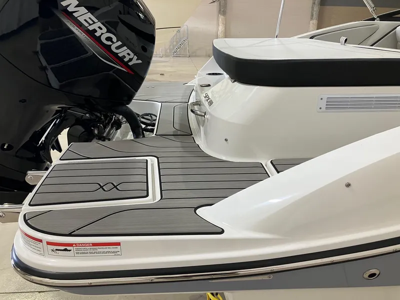 Slide: The Image of 2025 Sea Ray SPX 190 Outboard boat with Mercury engine, featuring sleek deck design. - 6