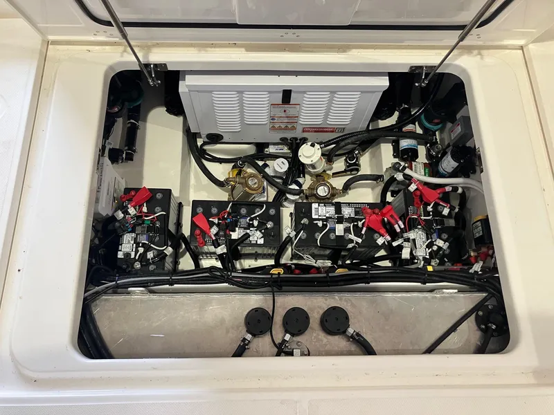 Slide: The Image of Engine compartment of 2025 Boston Whaler 325 Conquest, showcasing wiring and components. - 9