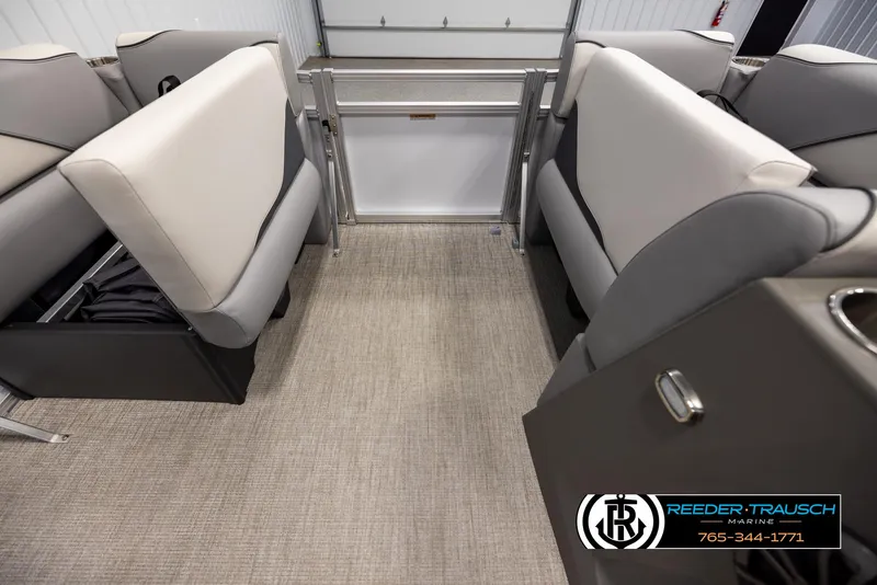 Slide: The Image of Interior of 2025 Avalon VEN RF boat with gray seating and carpeted floor. - 19