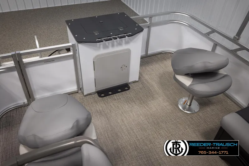 Slide: The Image of Interior of 2025 Avalon VEN RF boat with gray seating and Reeder-Trausch Marine logo. - 22