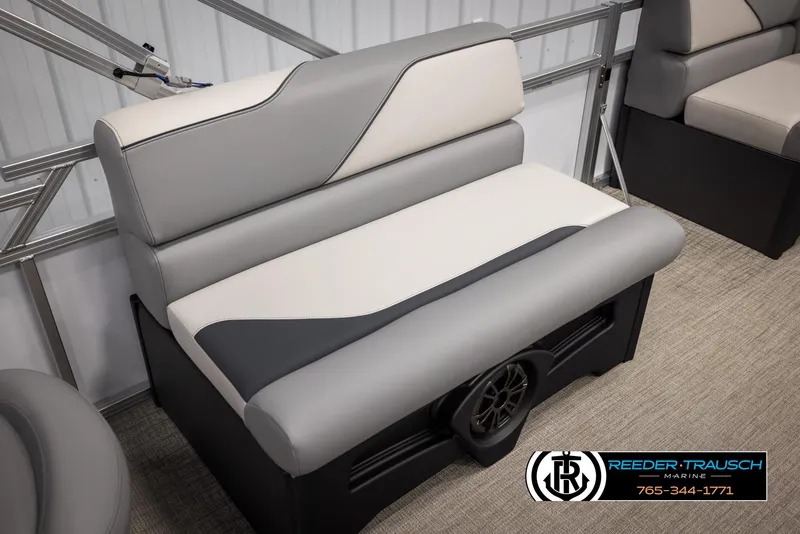 Slide: The Image of 2025 Avalon VEN RF boat seat with gray and white upholstery in a showroom. - 23