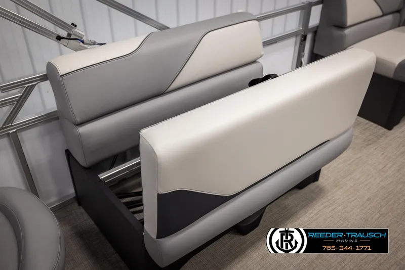Slide: The Image of 2025 Avalon VEN RF boat seating with gray and white upholstery, Reeder-Trausch Marine logo. - 24