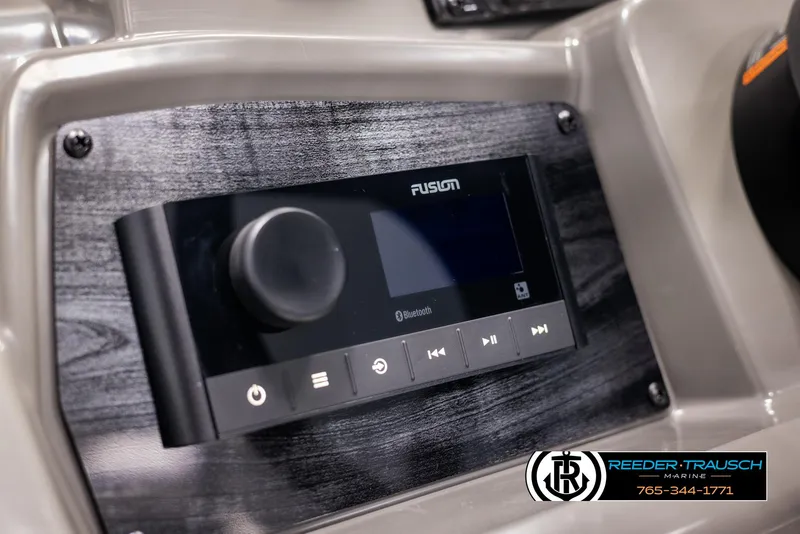 Slide: The Image of Close-up of Fusion Bluetooth stereo system in 2025 Avalon VEN RF boat dashboard. - 28