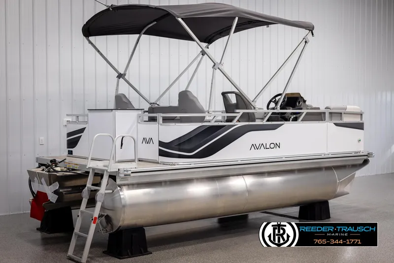 Slide: The Image of 2025 Avalon VEN RF pontoon boat with canopy in showroom. - 6