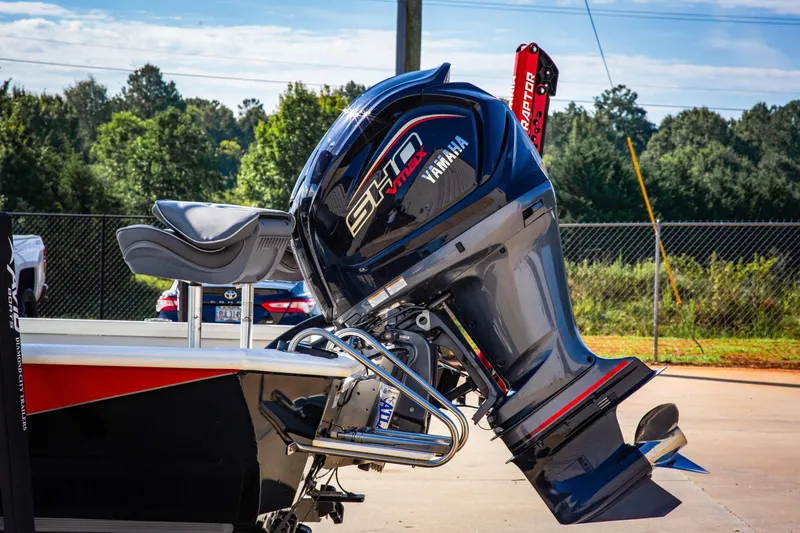 Slide: The Image of Avid 23 Magnum 2022 boat with Yamaha SHO engine in outdoor setting. - 4