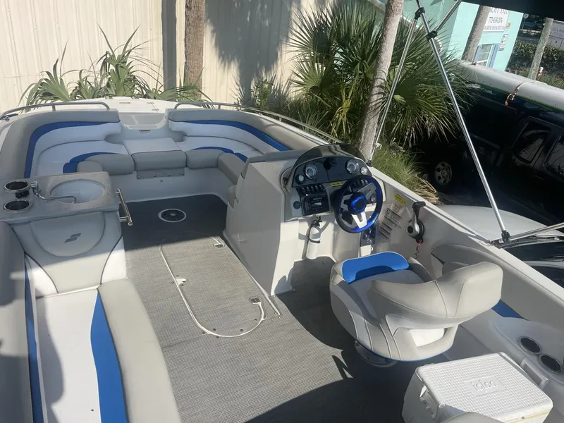 Slide: The Image of 2017 Starcraft MDX 211 O/B boat interior with seating and steering console. - 3