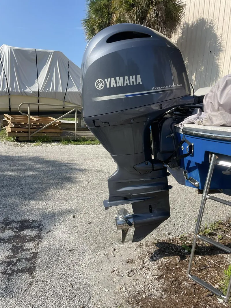 Slide: The Image of 2017 Starcraft MDX 211 O/B with Yamaha outboard motor, parked outdoors. - 9