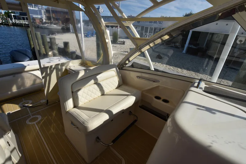 Slide: The Image of Interior of 2019 Grady-White Freedom 325 boat with seating and windows. - 20