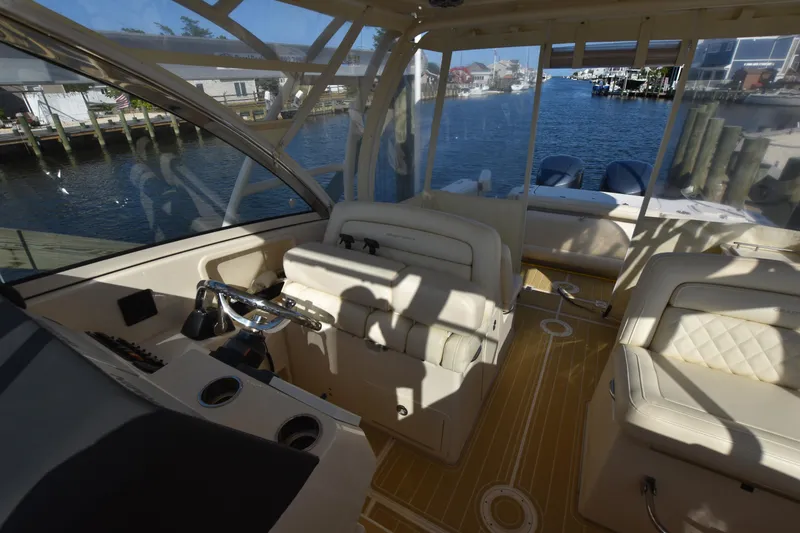 Slide: The Image of Interior of 2019 Grady-White Freedom 325 boat with waterfront view. - 21