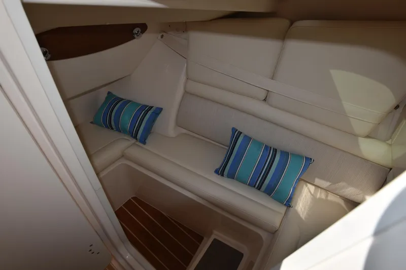 Slide: The Image of 2019 Grady-White Freedom 325 cabin interior with striped cushions. - 28
