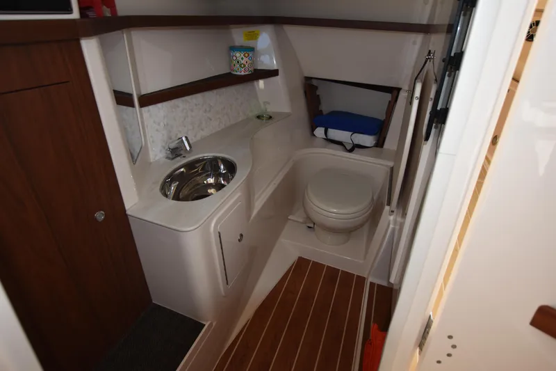 Slide: The Image of 2019 Grady-White Freedom 325 boat bathroom with sink and toilet. - 30