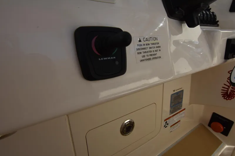 Slide: The Image of Control panel of a 2019 Grady-White Freedom 325 boat with Lewmar switch. - 33
