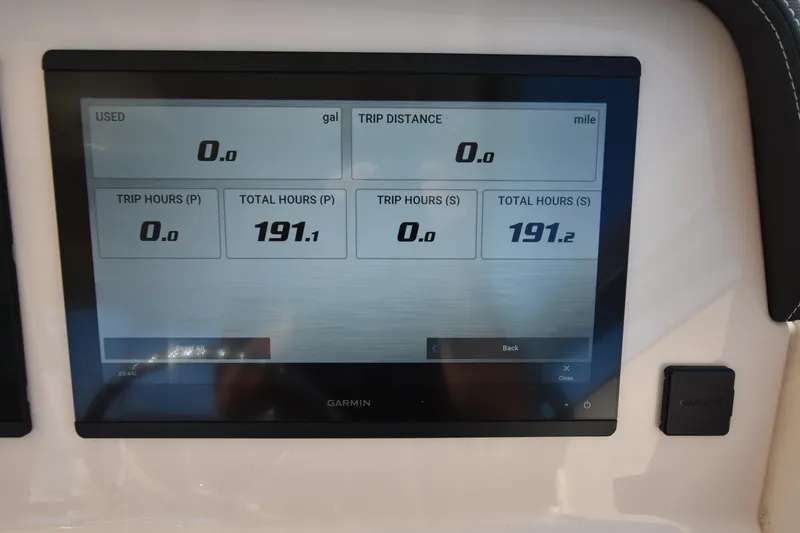 Slide: The Image of Garmin display on 2019 Grady-White Freedom 325 showing trip and total hours. - 34