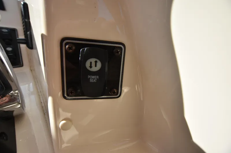 Slide: The Image of Power seat control on 2019 Grady-White Freedom 325 boat interior. - 35