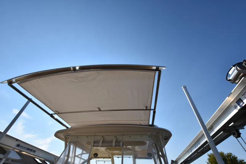Slide: The Image of Grady-White Freedom 325 boat canopy against clear blue sky, 2019 model. - 41