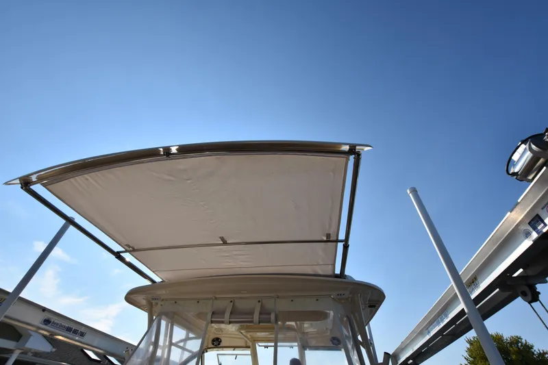 Slide: The Image of Grady-White Freedom 325 boat canopy against clear blue sky, 2019 model. - 42