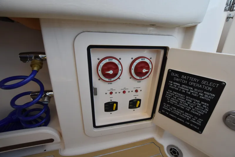 Slide: The Image of 2019 Grady-White Freedom 325 dual battery switch panel with operation instructions. - 44