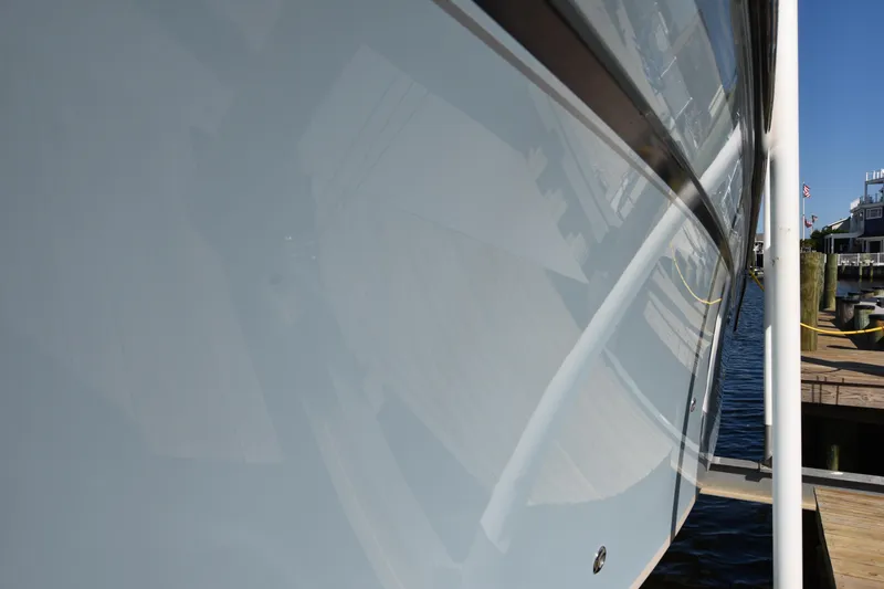 Slide: The Image of Close-up of 2019 Grady-White Freedom 325 boat hull at dock. - 47