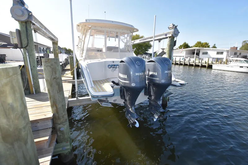 Slide: The Image of 2019 Grady-White Freedom 325 boat docked with twin Yamaha 300 engines. - 49