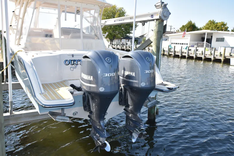 Slide: The Image of 2019 Grady-White Freedom 325 boat with twin Yamaha 300 engines docked. - 5