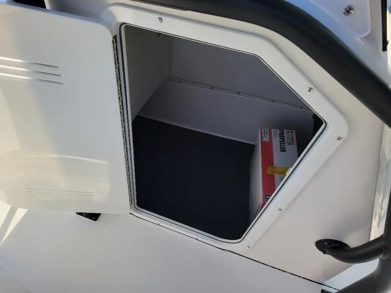 Slide: The Image of Open storage compartment in 2025 Edgewater 208 WATCHMAN boat. - 10