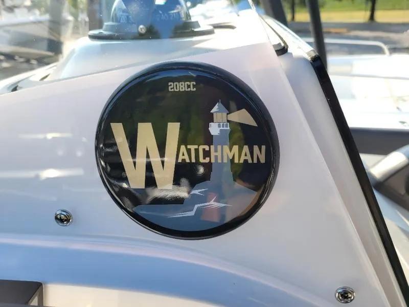 Slide: The Image of Edgewater 208 WATCHMAN 2025 logo with lighthouse design on boat dashboard. - 15