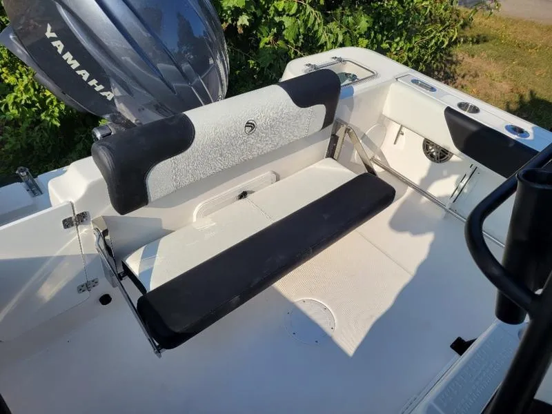 Slide: The Image of 2025 Edgewater 208 WATCHMAN boat interior with Yamaha engine, featuring seating and storage. - 18