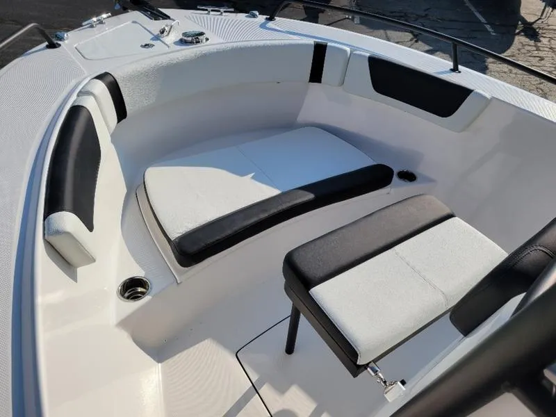 Slide: The Image of 2025 Edgewater 208 WATCHMAN boat interior with white and black seating. - 20