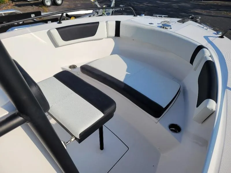 Slide: The Image of Edgewater 208 WATCHMAN 2025 boat interior with cushioned seating and sleek design. - 3