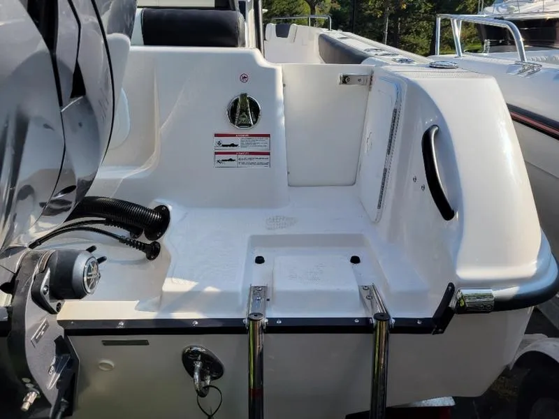 Slide: The Image of 2025 Edgewater 208 WATCHMAN boat stern with ladder and engine mount. - 6