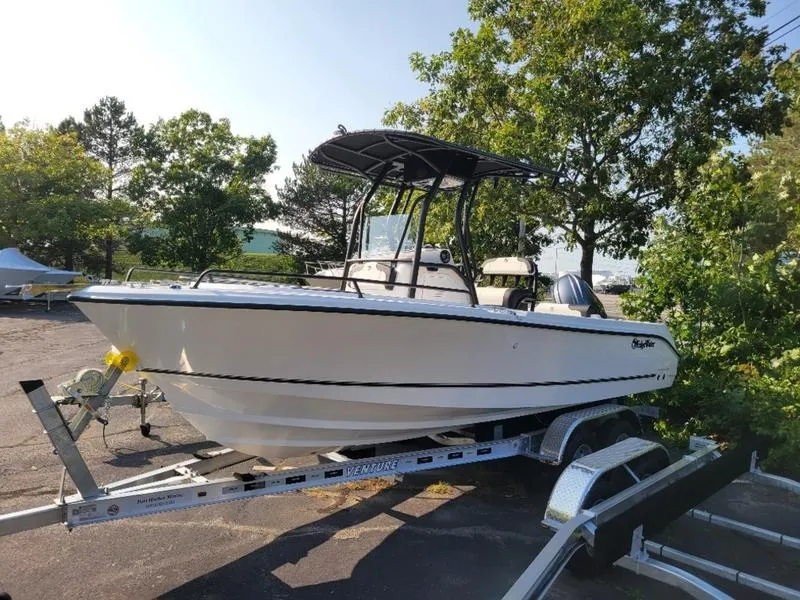 Slide: The Image of 2025 Edgewater 208 WATCHMAN boat on trailer, parked outdoors. - 7