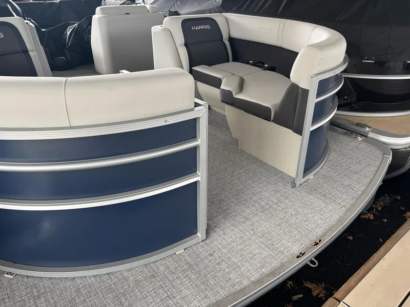 Slide: The Image of 2025 Harris Cruiser 210 SL pontoon boat interior with stylish seating and modern design. - 4