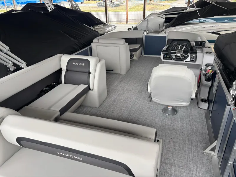 Slide: The Image of 2025 Harris Cruiser 210 SL pontoon boat interior with modern seating and helm. - 7