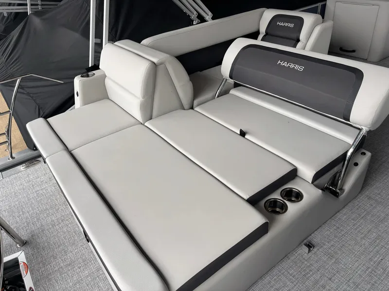 Slide: The Image of 2025 Harris Cruiser 210 SL boat interior with adjustable seating and cup holders. - 8