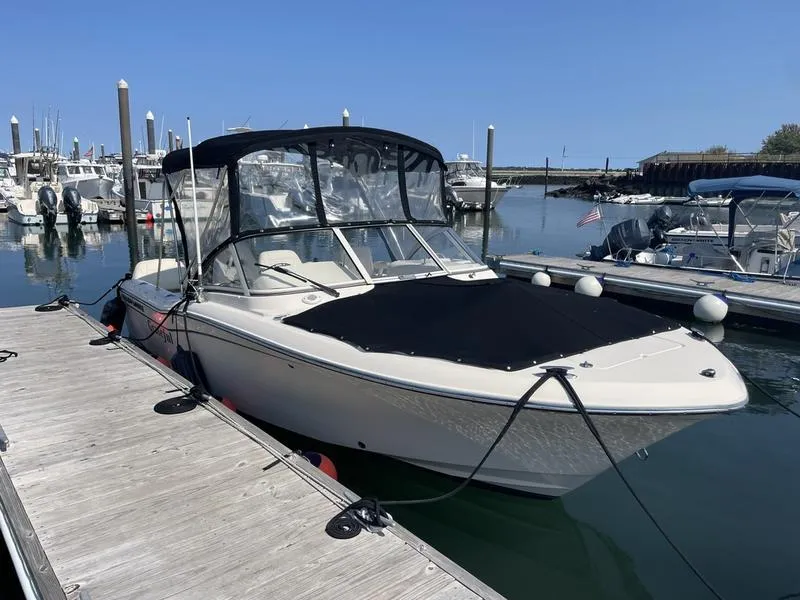 Slide: The Image of 2020 Grady-White 215 Freedom boat docked in marina under clear blue sky. - 5