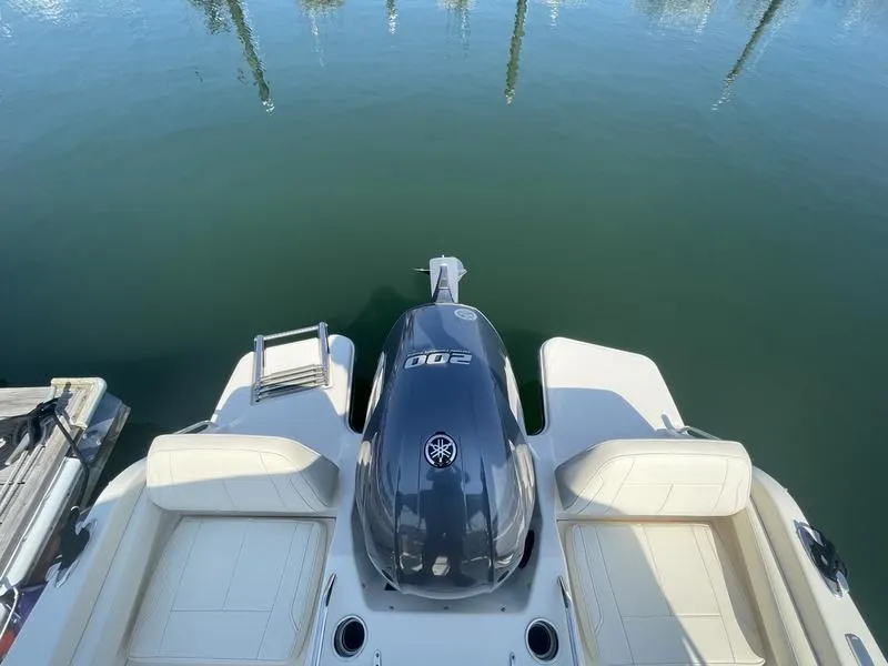 Slide: The Image of 2020 Grady-White 215 Freedom boat with Yamaha outboard motor on calm water. - 9