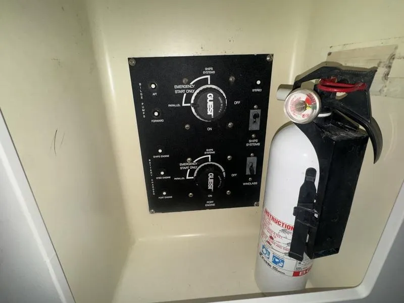 Slide: The Image of Control panel and fire extinguisher on 2005 Four Winns 298 Vista boat. - 10