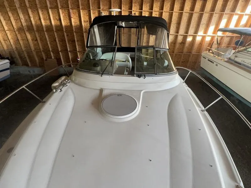 Slide: The Image of 2005 Four Winns 298 Vista boat in storage, front view. - 12
