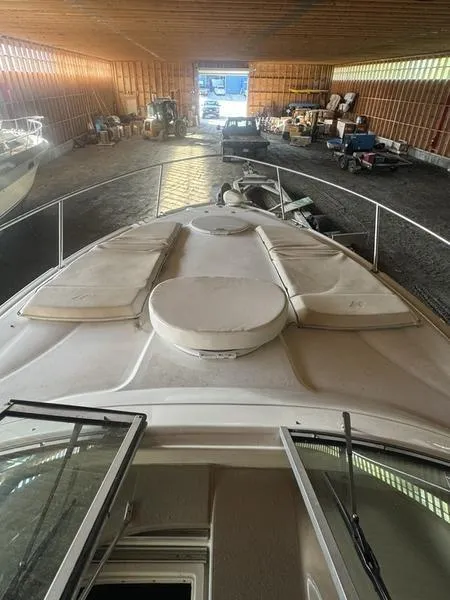 Slide: The Image of 2005 Four Winns 298 Vista boat stored in a spacious indoor facility. - 3