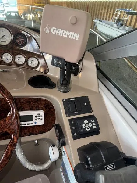 Slide: The Image of 2005 Four Winns 298 Vista boat dashboard with Garmin GPS and control panel. - 33
