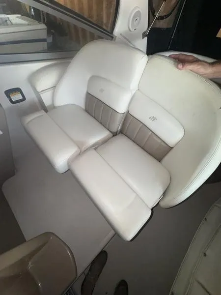 Slide: The Image of 2005 Four Winns 298 Vista boat interior with white and beige seating. - 35