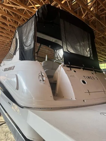 Slide: The Image of 2005 Four Winns 298 Vista boat with black canopy in storage. - 38
