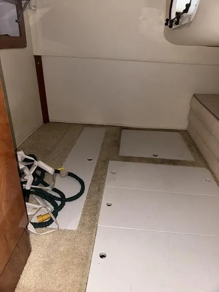 Slide: The Image of Interior cabin of 2005 Four Winns 298 Vista boat with storage panels. - 4