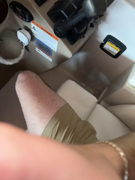 Slide: The Image of Interior of a 2005 Four Winns 298 Vista boat cockpit with controls and seating. - 6