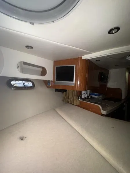 Slide: The Image of Interior of 2005 Four Winns 298 Vista boat with cozy cabin and modern amenities. - 7
