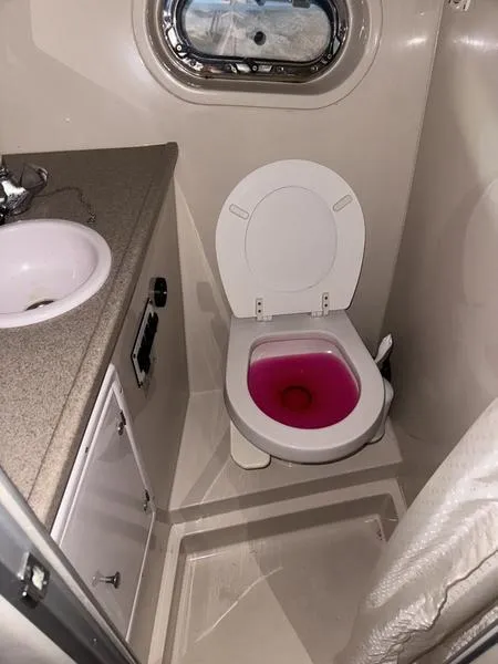 Slide: The Image of 2005 Four Winns 298 Vista boat bathroom with sink and toilet. - 8