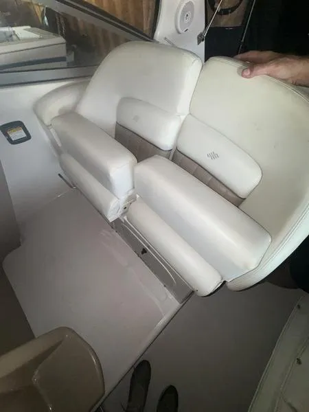 Slide: The Image of 2005 Four Winns 298 Vista boat interior with white cushioned seating. - 9