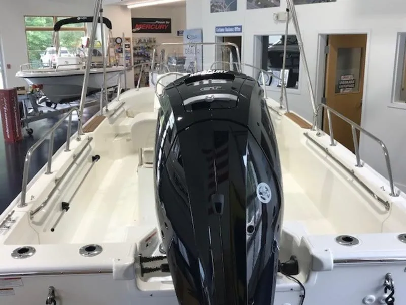 Slide: The Image of 2023 Boston Whaler 170 Montauk boat interior with powerful outboard motor. - 13