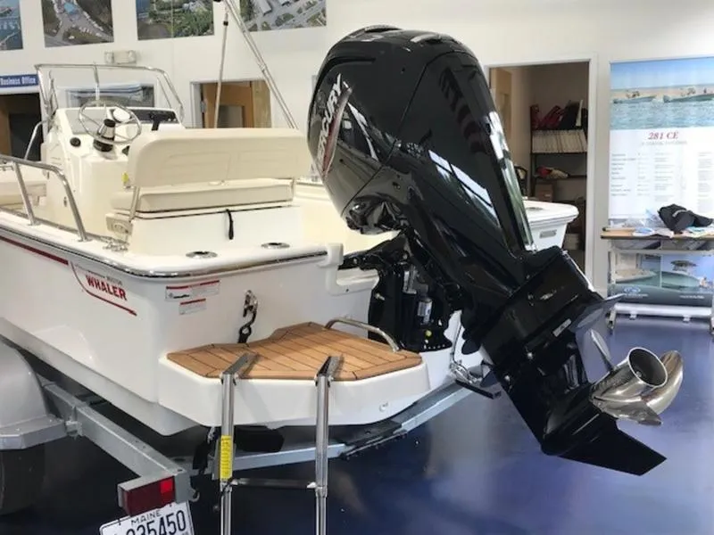 Slide: The Image of 2023 Boston Whaler 170 Montauk boat with powerful outboard motor in showroom. - 3