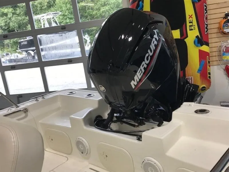 Slide: The Image of 2023 Boston Whaler 170 Montauk with Mercury outboard engine in showroom. - 6